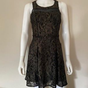 Beautifully cocktails dress. Is black with gold embellish tread. Brand new